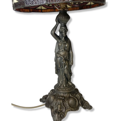 108 - A bronzed metal Tiffany style table lamp. Base in classical lady form. 
55cm tall