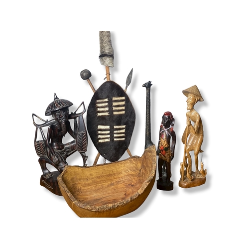 112 - A job lot of Tribal Art, including a Zulu shield set, large Olive wood bowl and metal Giraffe.