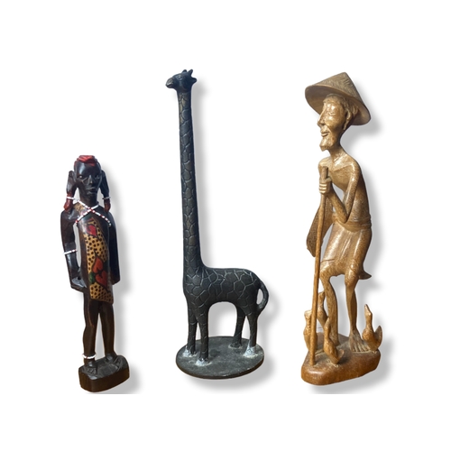 112 - A job lot of Tribal Art, including a Zulu shield set, large Olive wood bowl and metal Giraffe.