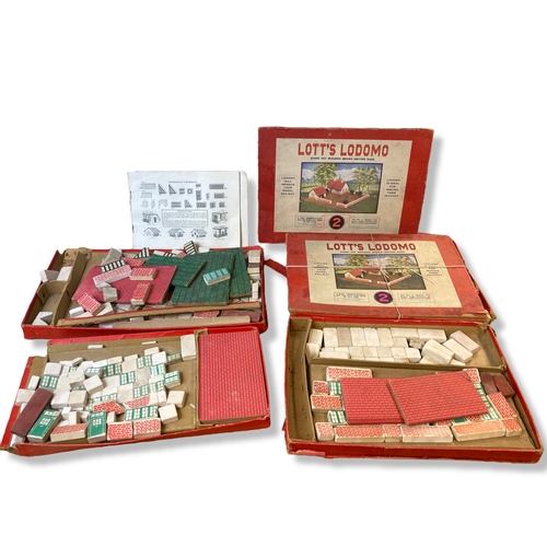 117 - Four boxed early 20th C Lotts Lodomo Tutor building blocks.