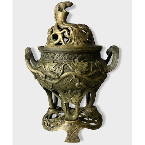 168 - A Chinese Bronze tripod censer with stand & cover.
Relief decorated with Grape vines and rats. 
Four... 