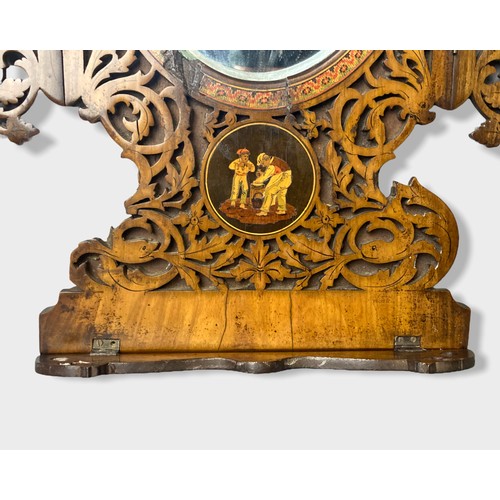 94 - A 19th Century Sorrento Ware walnut wall mirror, the hinged fretwork panels inlaid with figurative v... 