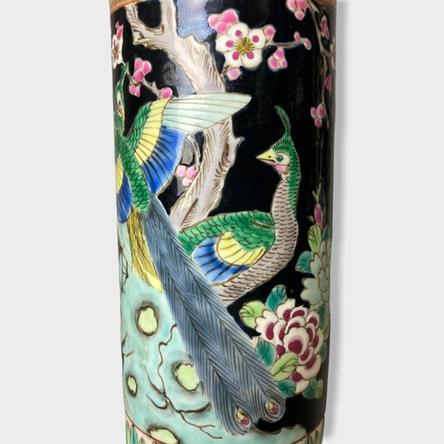 154 - A pair of Japanese Yamatoku porcelain sleeve vases. Black ground with painted enamels with exotic bi... 