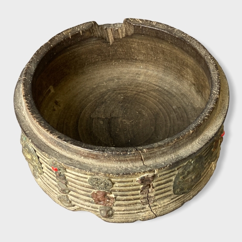 176 - An early Chinese Tibetan wooden rice bowl. Applied metal and Cabochon mounted. (Missing cover).
11 x... 