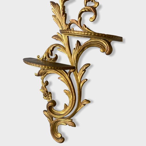 40 - A Rococo type Gilt metal wall shelf / Bracket. 
55cm High.