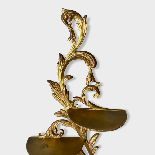 40 - A Rococo type Gilt metal wall shelf / Bracket. 
55cm High.