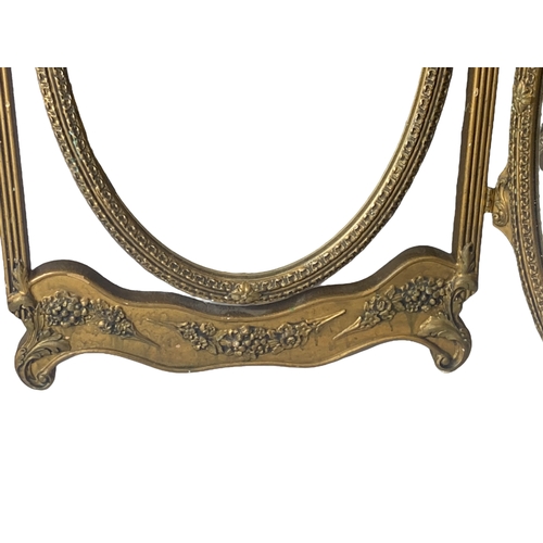 23 - A gilded tri-fold Travel Dresser Mirror.