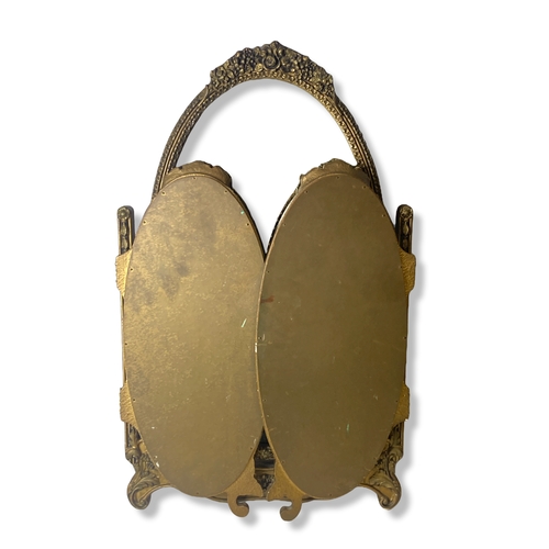 23 - A gilded tri-fold Travel Dresser Mirror.