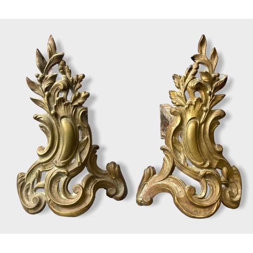 85 - A pair of French Rococo Gilt bronze Chenets.