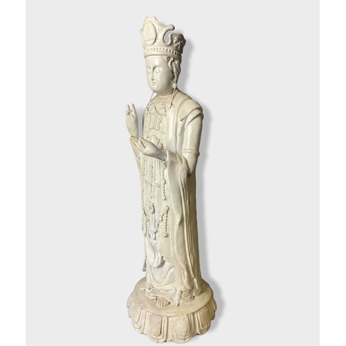 119B - A large Chinese plaster figure of Guanyin. 
54cm Tall