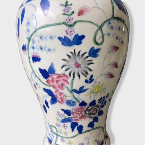 58 - A pair of Chinese hand painted porcelain vases.
Painted with stylised blossoming floral motif. 
Unma... 