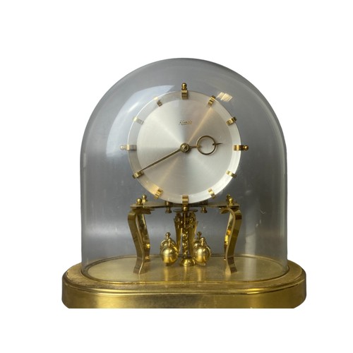 109 - A vintage Kundo (Kieninger & Obergfell) Anniversary clock under glass dome. 23cm wide x 24cm tall