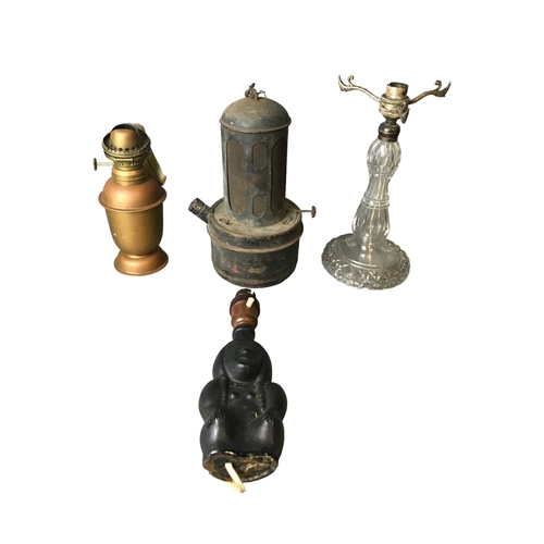 123 - A collection of Lamps including a Brass Ship Lantern and a Raydyot Green House Paraffin Heater