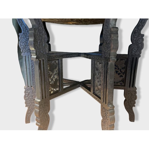 36 - large Persian Brass & wooden tray table.
Embossed brass tray depicting rider on horseback, surrounde... 