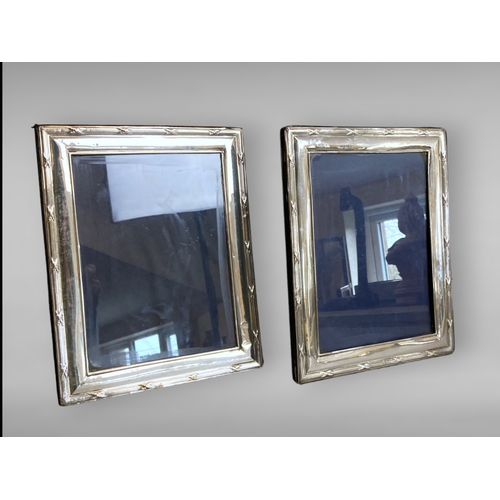 58 - Two sterling Silver Photo frames. 
London Hallmarks. 
25 x 19.5cm