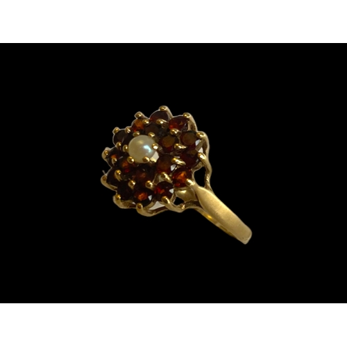 26 - vintage 9 carat gold Garnet & pearl ladies ring. Set with central seed pearl supported by cluster of... 