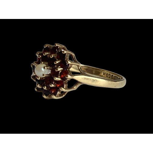 26 - vintage 9 carat gold Garnet & pearl ladies ring. Set with central seed pearl supported by cluster of... 