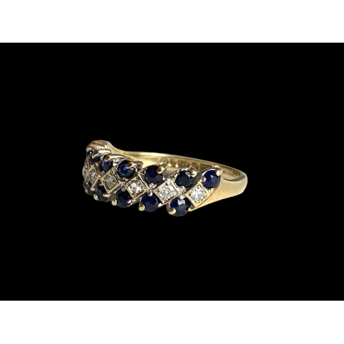 28 - A vintage 9 carat gold, Sapphire & Diamond ladies ring.
Set with 8 central Diamonds bordered by Sapp... 