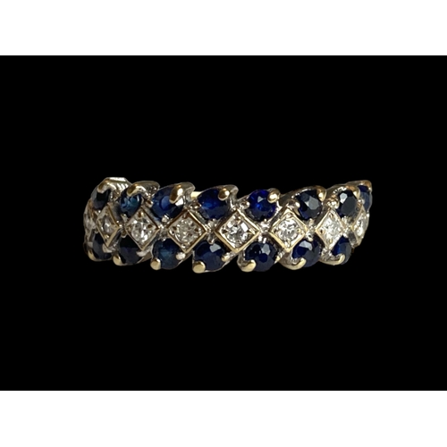 28 - A vintage 9 carat gold, Sapphire & Diamond ladies ring.
Set with 8 central Diamonds bordered by Sapp... 