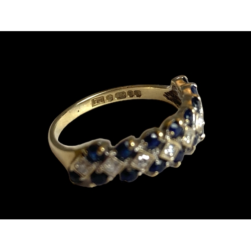 28 - A vintage 9 carat gold, Sapphire & Diamond ladies ring.
Set with 8 central Diamonds bordered by Sapp... 