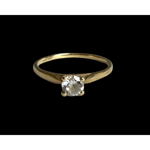 30 - A 9 carat gold and Cubic Zirconia engagement ring. 
Set with a round cut solitaire CZ.
UK Hallmarks.... 