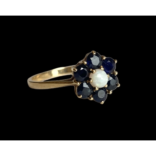 31 - A vintage P&R Bushell 9 carat gold, Opal & Sapphire cluster ladies ring.
Set with central Opal surro... 