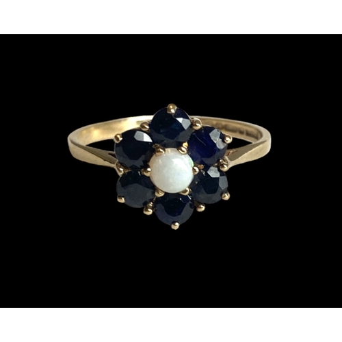 31 - A vintage P&R Bushell 9 carat gold, Opal & Sapphire cluster ladies ring.
Set with central Opal surro... 