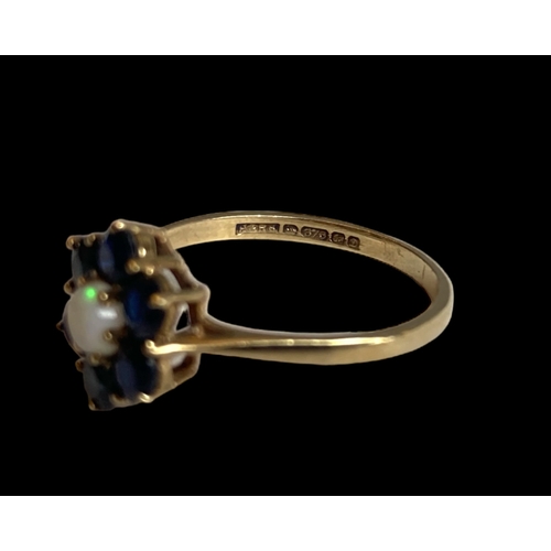 31 - A vintage P&R Bushell 9 carat gold, Opal & Sapphire cluster ladies ring.
Set with central Opal surro... 