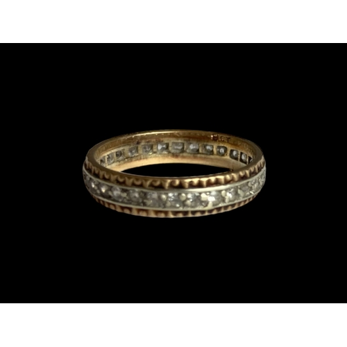 35 - A 9 carat gold & Diamond full eternity ring. 
Yellow & white gold band set with diamonds. 
Marked 9K... 