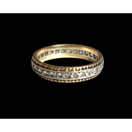 35 - A 9 carat gold & Diamond full eternity ring. 
Yellow & white gold band set with diamonds. 
Marked 9K... 