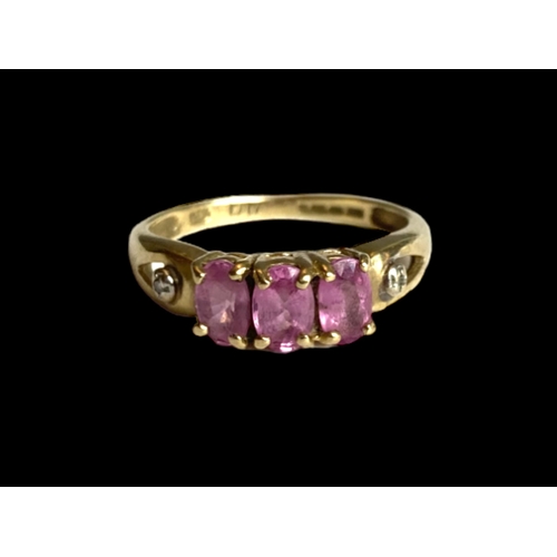 38 - A 9 carat gold Amethyst & Diamond ladies ring.
Set with three Amethyst & two bordering accent diamon... 