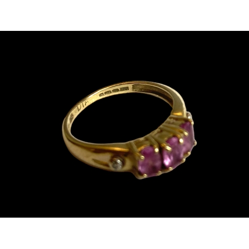 38 - A 9 carat gold Amethyst & Diamond ladies ring.
Set with three Amethyst & two bordering accent diamon... 