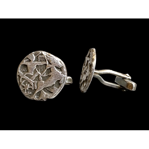 40 - A pair of Egyptian Silver Mens Cufflinks.
Relief decorated with an Archer on Chariot. 
Unmarked but ... 