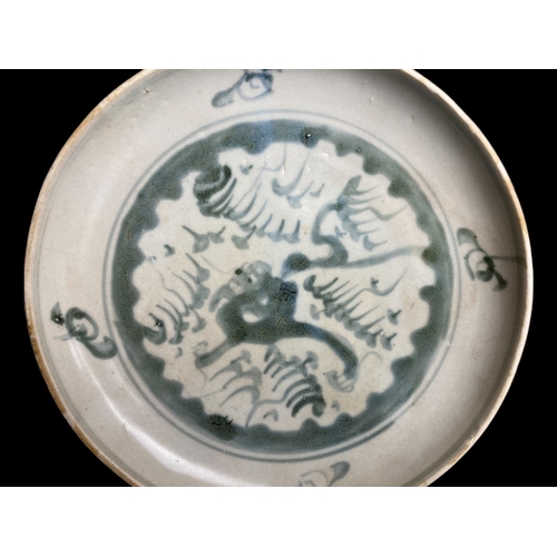 158 - A Chinese Nanking cargo blue & white dish.
Qianlong period, C1750.
Hand painted with a Dragon amongs... 