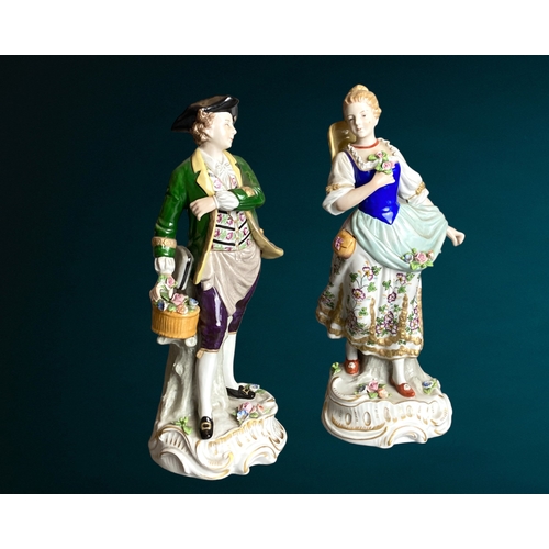 83 - A pair of Sitzendorf hand painted porcelain figures. 
Depicting Flower seller & sweetheart. 
24cm Ta... 