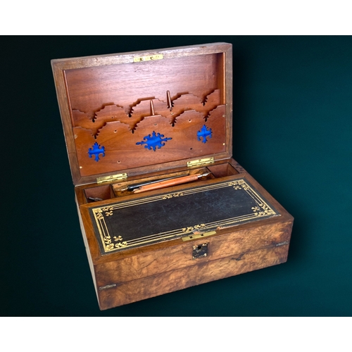 149 - A Victorian Walnut writing slope with letter rack.
Fold out black & gilt embossed interior with lett... 