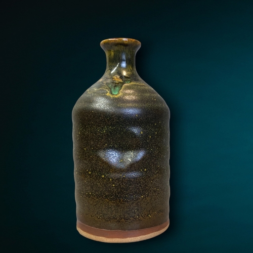 140 - A Japanese Shino Chawan 'Wabi Sabi' pottery Sake bottle.
Signed to base.
19cm tall.