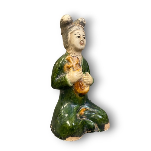 163 - A CHINESE TANG TYPE SANCAI TOMB FIGURE (MINGQI) MUSICIAN FIGURE. 
15CM TALL.