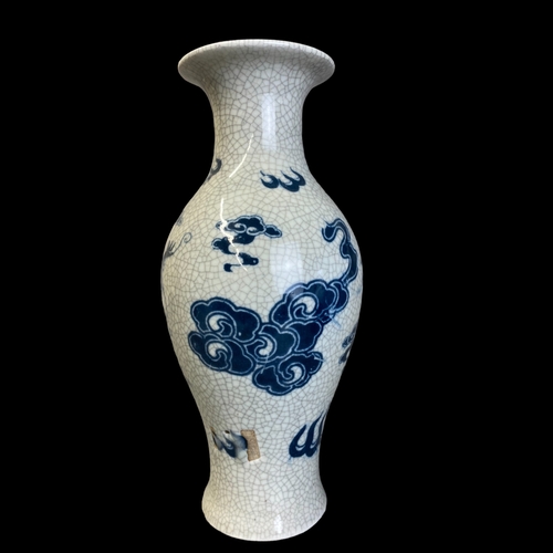 169 - A CHINESE CRACKLE GLAZED PORCELAIN BALUSTER VASE. HAND PAINTED WITH A 5-CLAW DRAGON AMONGST THE CLOU... 