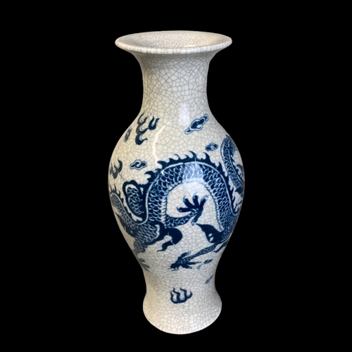 169 - A CHINESE CRACKLE GLAZED PORCELAIN BALUSTER VASE. HAND PAINTED WITH A 5-CLAW DRAGON AMONGST THE CLOU... 