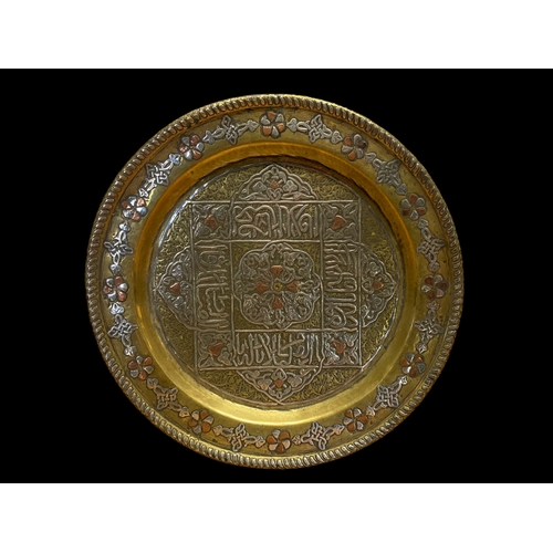 68 - A 19TH CENTURY INDIAN BRASS, SILVER & COPPER APPLIQUE PLATE.
21CM DIAMETER