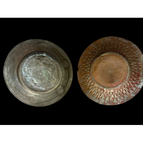 69 - A COLLECTION OF FOUR TINNED COPPER OTTOMAN EMPIRE DISHES.
LARGEST 30CM DIAMETER