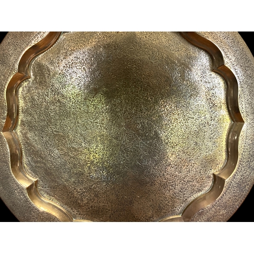 70 - TWO LARGE VINTAGE PERSIAN BRASS TABLE TRAYS. 
LARGEST MEASURES - 59CM DIAMETER