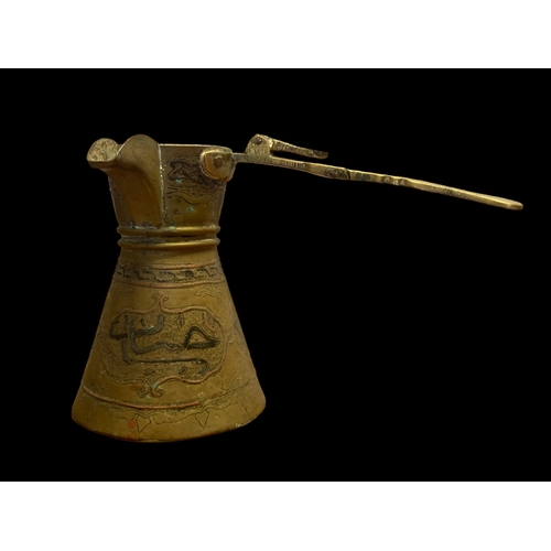 72 - A COLLECTION OF MIDDLE EASTERN METAL & BRASS. INCLUDING A SIDE HANDLE CHOCOLATE POT.