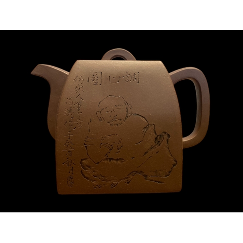 185 - TWO CHINESE YIXING POTERY TEAPOTS.