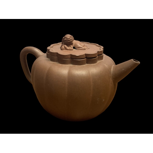 185 - TWO CHINESE YIXING POTERY TEAPOTS.