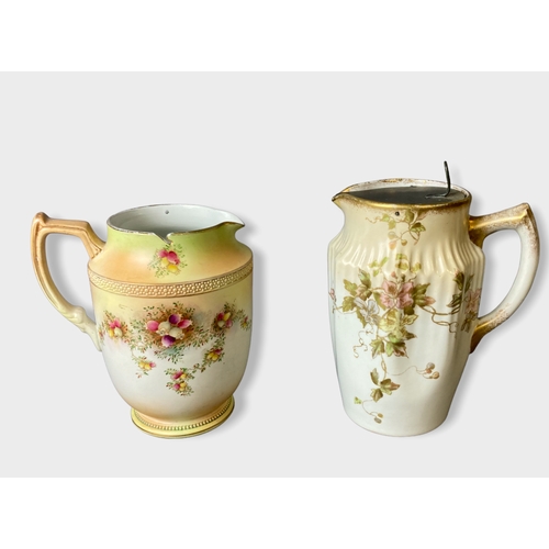 118 - A collection of four Wiltshaw & Robinson carlton ware blush water jugs. Including Heather & Hibiscus... 