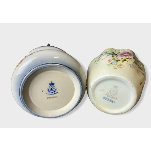 121 - Two Wiltshaw & Robinson Carlton ware biscuit barrels. Including Arvista & Rose garland pattern.
Tall... 