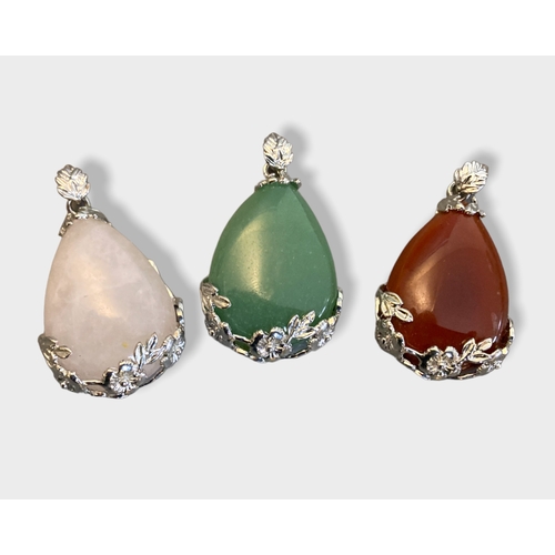 55 - A collection of silver & white metal polished stone pendants & necklace. Some marked 925.