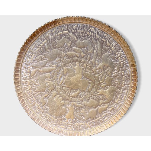 14 - large Persian Brass & wooden tray table.
Embossed brass tray depicting rider on horseback, surrounde... 